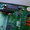 The PCB is held in by clips molded into the plastic case.