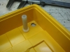 Preparing to repair broken screw post with some random plastic bits from junk box.