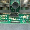 Bottom half of the upper circuit board.  The 16-pin DIP component is an MC14573 quad opamp.