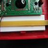 Backlight module held in place with a strip of circuit board and two screws.