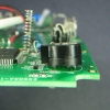 The piezo buzzer, sitting askew. Didn't quite make it in all the way.