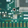 The large SMT component (crystal) is removed for better access to the area. After cleaning with IPA, another break is found near the transistor labeled '99'.