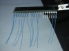 Pigtails are wire-wrapped with 30 AWG wire using a manual wire-wrap tool.