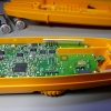 One self-tapping and two machine screws fasten the PCB down.  The machine screws also connect the test leads to the board.