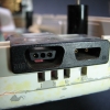 A close-up of the HP-IL connection.  The rectangular holes beneath allow access to DIP switches on the PCB.