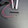 The diode is securely soldered to the battery lead and covered with heat shrink.