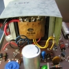 Dual-primary transformer can be wired for 120 or 240Vac input. Exposed terminals are covered with a stick-on fish paper shield.