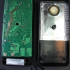 Opening the case reveals two-board construction, and a shielded back with a large permanently-affixed piezo beeper element.